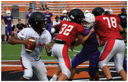 A football game is being played on a field. Description generated by AI