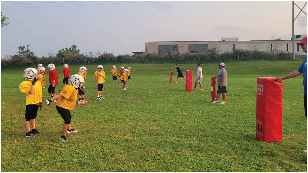 A football game is being played on a field. Description generated by AI