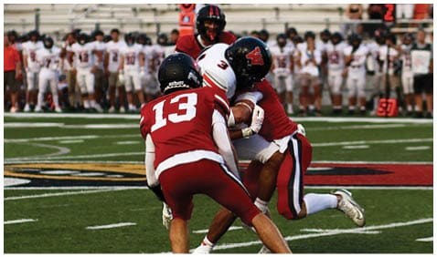 A football player running on the field. Description generated by AI