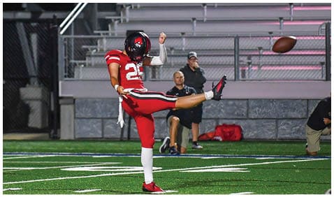 A football player running on the field. Description generated by AI