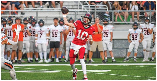 A football player running on the field. Description generated by AI