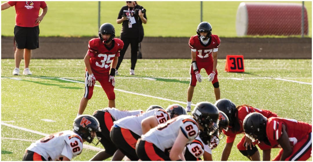 A football player wearing a blue jersey with the number 58 on it. Description generated by AI