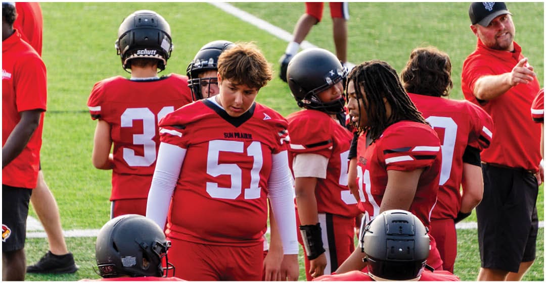 A football player wearing a blue jersey with the number 58 on it. Description generated by AI
