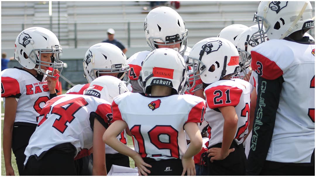 A football game is being played on a field. Description generated by AI