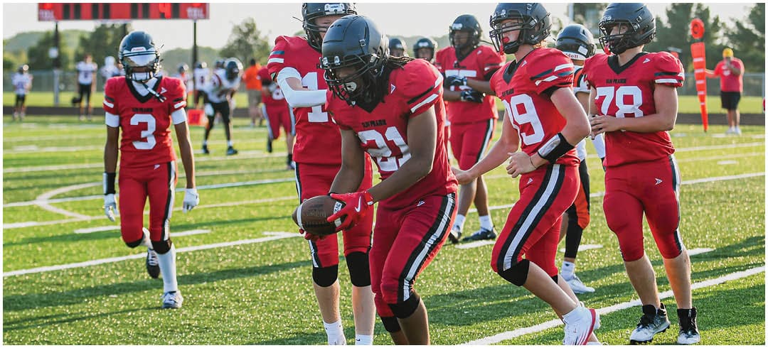 A football player wearing a blue jersey with the number 58 on it. Description generated by AI