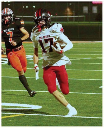A football player running on the field. Description generated by AI