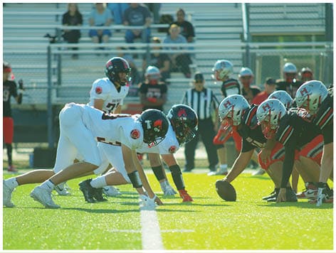 A football player wearing a blue jersey with the number 58 on it. Description generated by AI