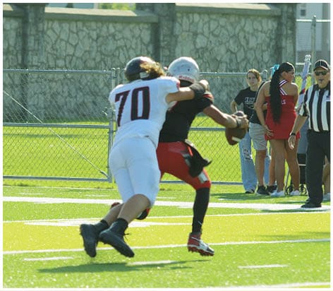 A football player wearing a blue jersey with the number 58 on it. Description generated by AI