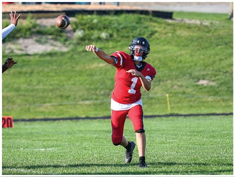 A football player wearing a blue jersey with the number 58 on it. Description generated by AI