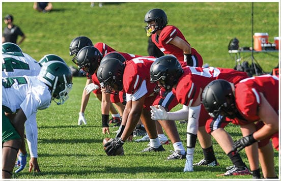 A football player wearing a blue jersey with the number 58 on it. Description generated by AI