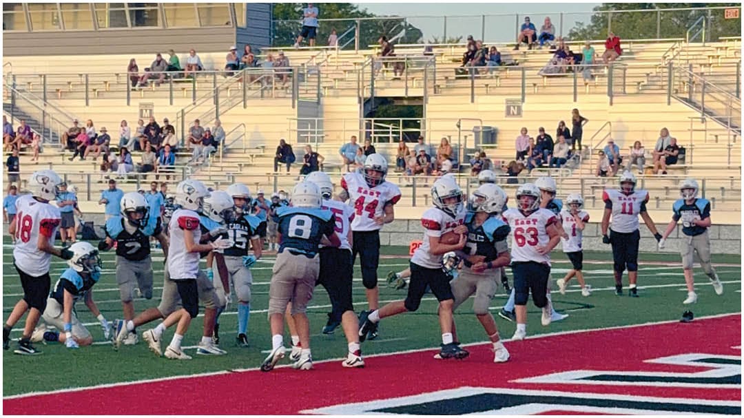 A football game is being played on a field. Description generated by AI