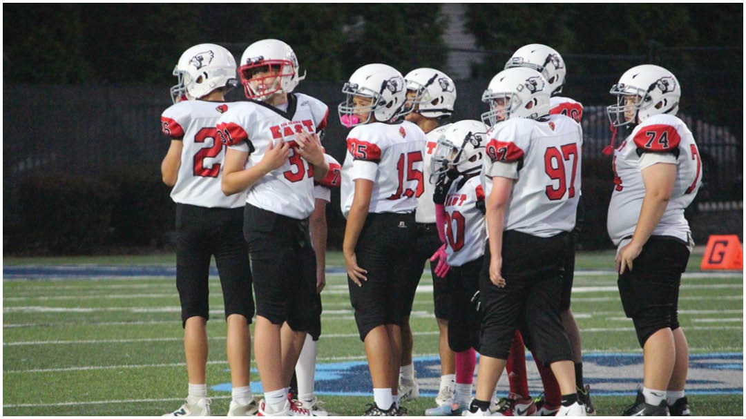 A football game is being played on a field. Description generated by AI