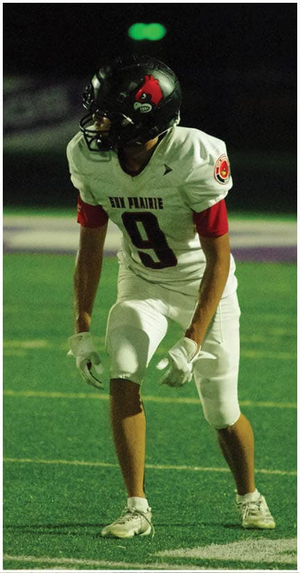 A football player wearing a blue jersey with the number 58 on it. Description generated by AI