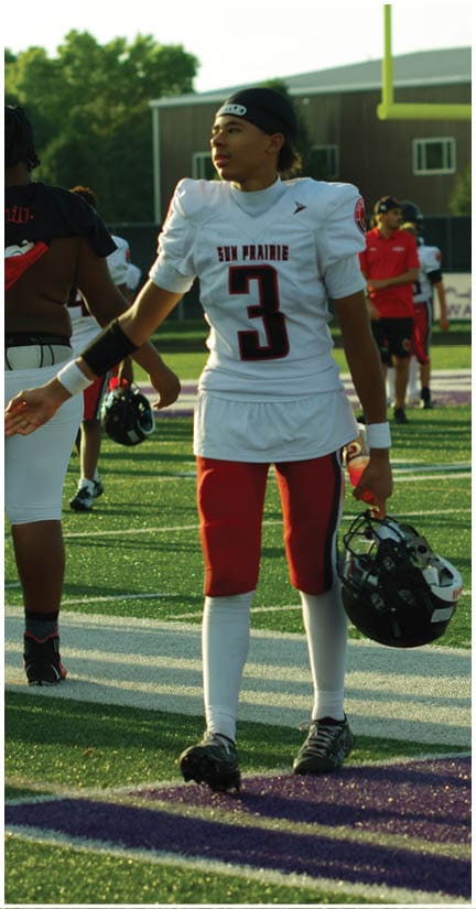 A football player wearing a blue jersey with the number 58 on it. Description generated by AI