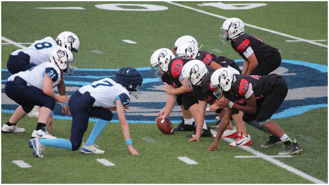 A football game is being played on a field. Description generated by AI