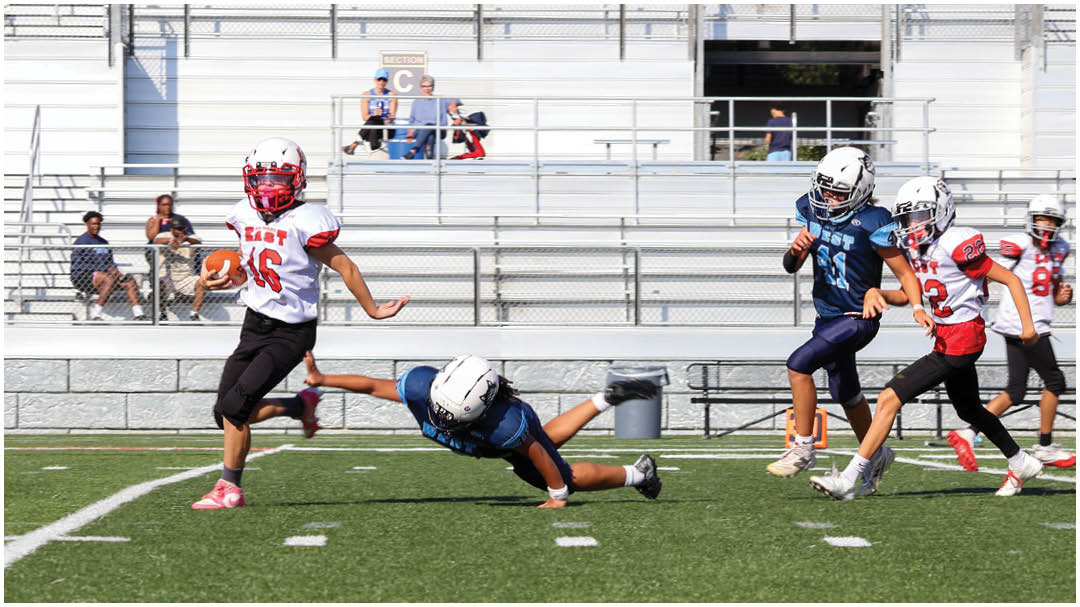 A football game is being played on a field. Description generated by AI