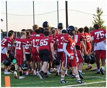 A football player wearing a blue jersey with the number 58 on it. Description generated by AI