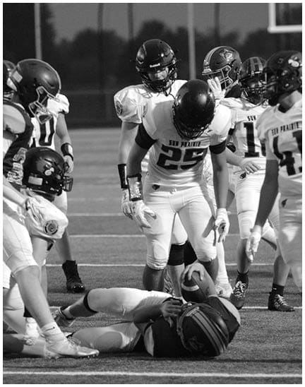 A football player wearing a blue jersey with the number 58 on it. Description generated by AI
