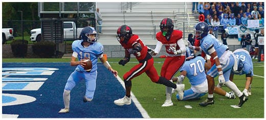 A football player catching a ball. Description generated by AI