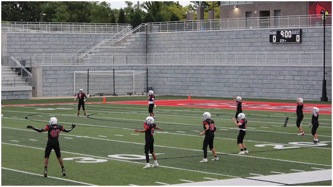 A football game is being played on a field. Description generated by AI