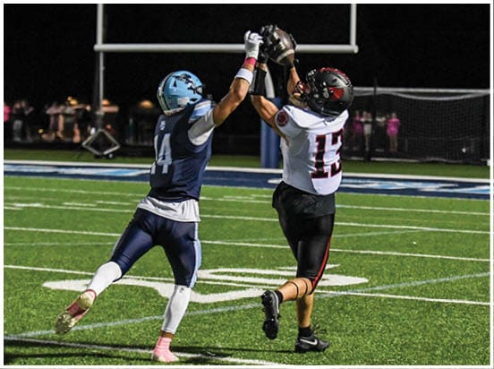 A football player wearing a blue jersey with the number 58 on it. Description generated by AI