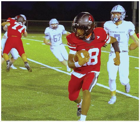 A football player wearing a blue jersey with the number 58 on it. Description generated by AI