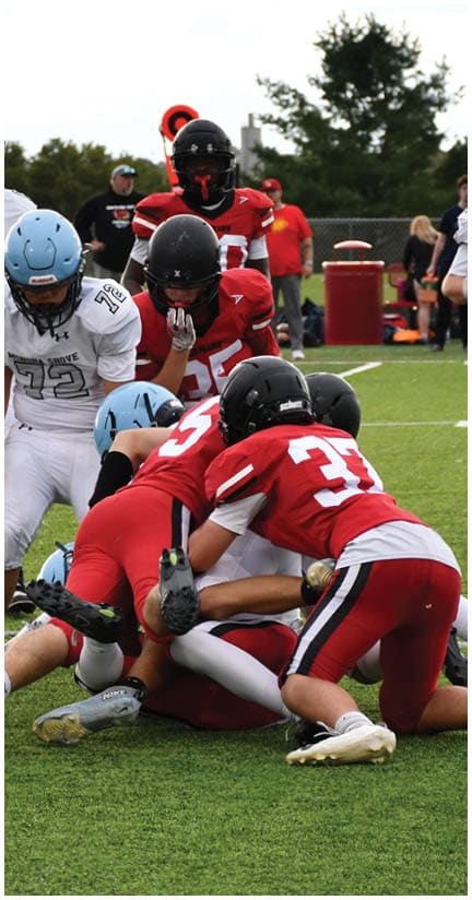 A football player wearing a blue jersey with the number 58 on it. Description generated by AI