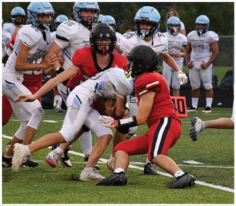 A football player wearing a blue jersey with the number 58 on it. Description generated by AI