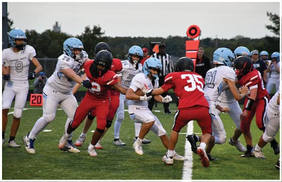 A football player wearing a blue jersey with the number 58 on it. Description generated by AI