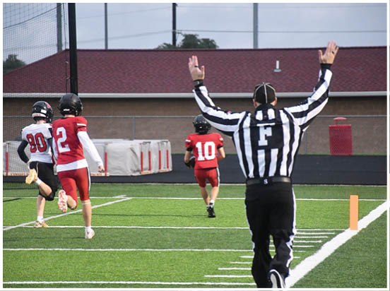 A football player wearing a blue jersey with the number 58 on it. Description generated by AI