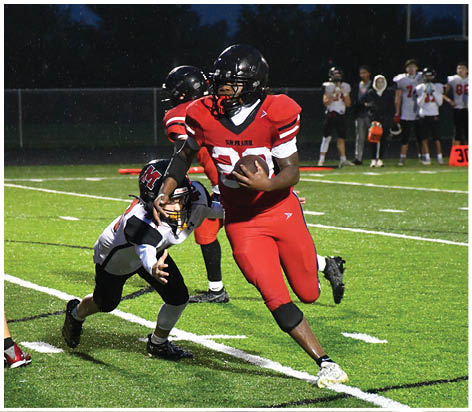A football player wearing a blue jersey with the number 58 on it. Description generated by AI
