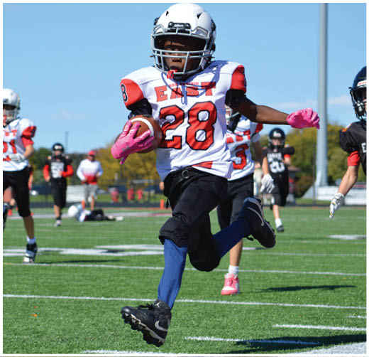 A football player catching a ball. Description generated by AI