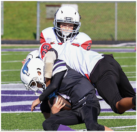 A football player catching a ball. Description generated by AI