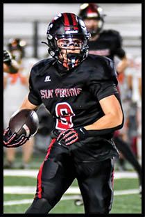 A football player running on the field. Description generated by AI