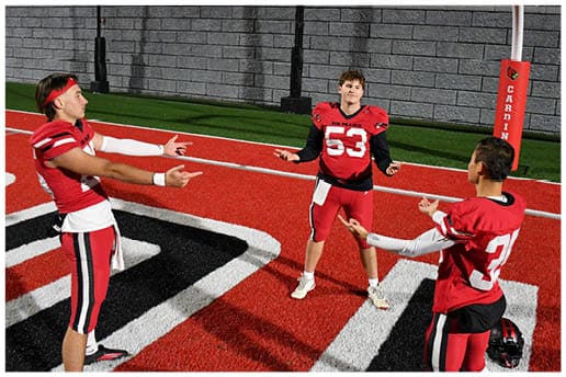 A football player running on the field. Description generated by AI