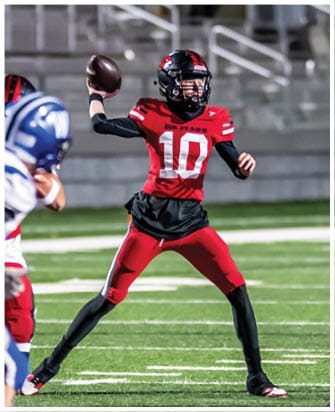 A football player running on the field. Description generated by AI