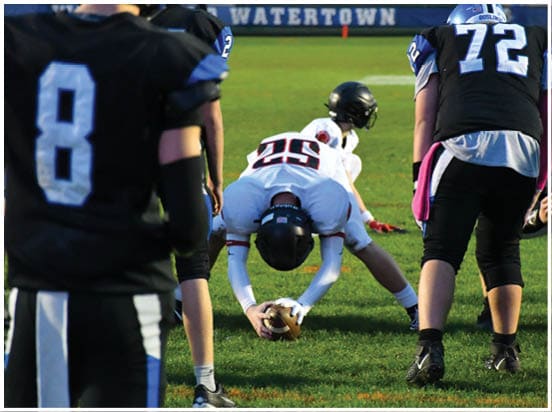 A football player wearing a blue jersey with the number 58 on it. Description generated by AI