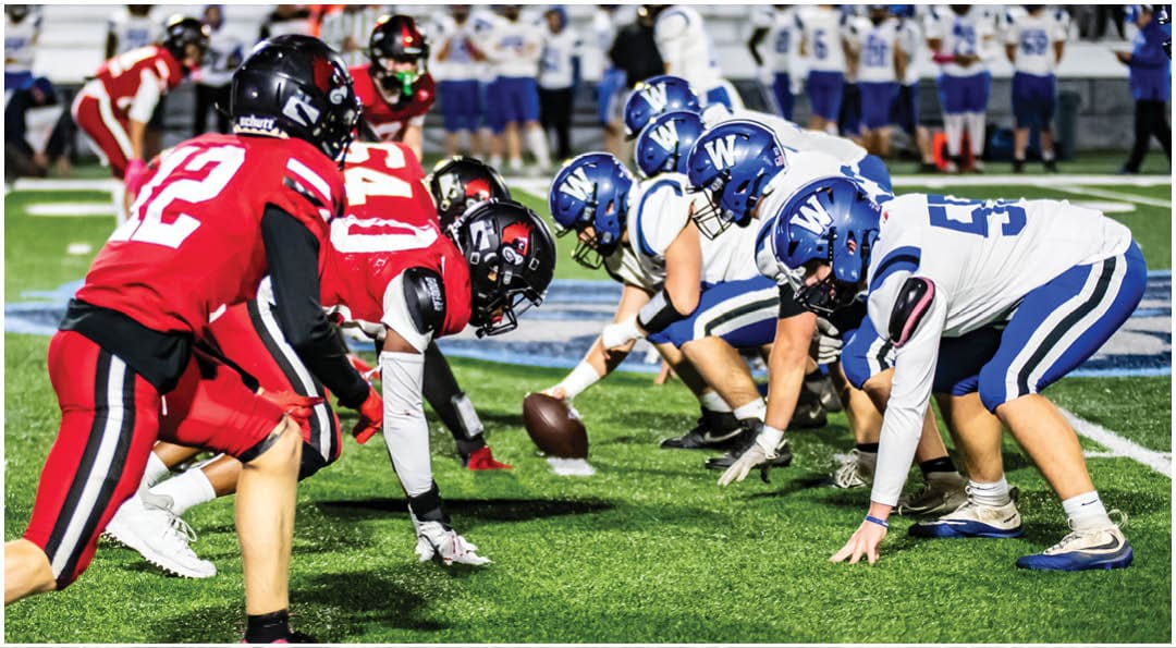 A football player wearing a blue jersey with the number 58 on it. Description generated by AI