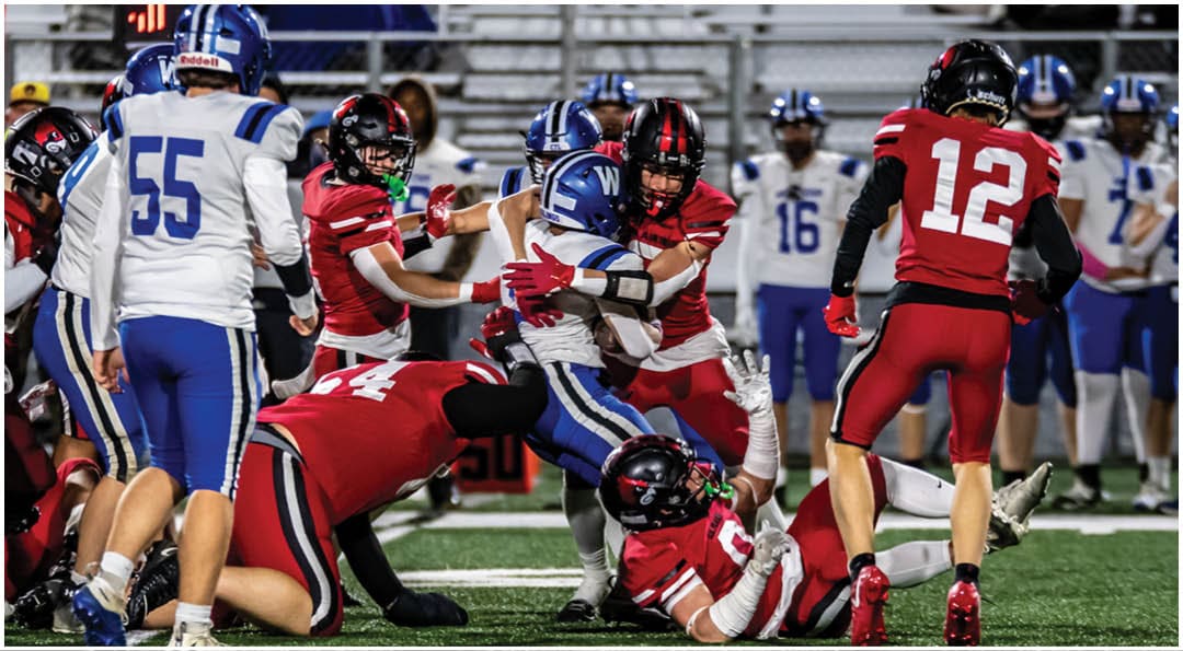 A football player wearing a blue jersey with the number 58 on it. Description generated by AI