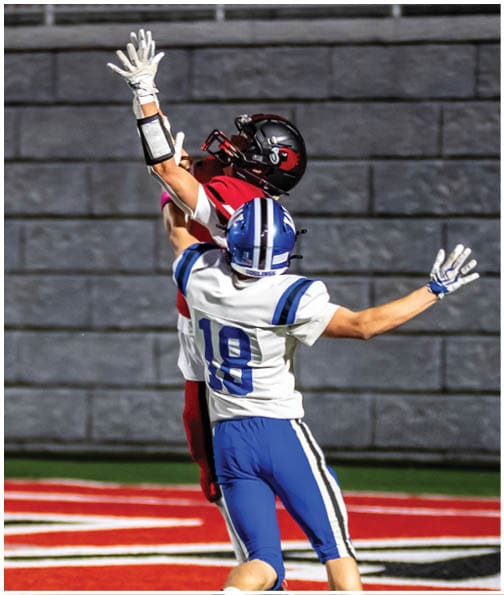 A football player wearing a blue jersey with the number 58 on it. Description generated by AI