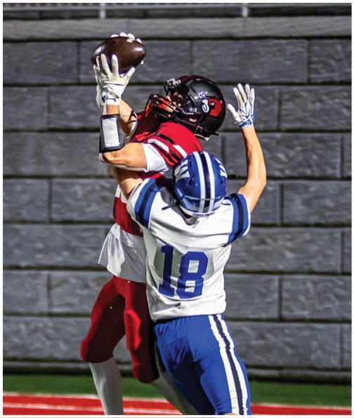 A football player wearing a blue jersey with the number 58 on it. Description generated by AI