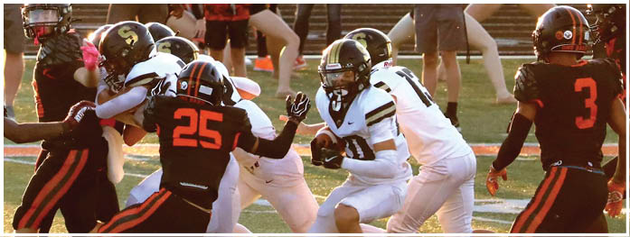 A football player is sliding on the ground. Description generated by AI