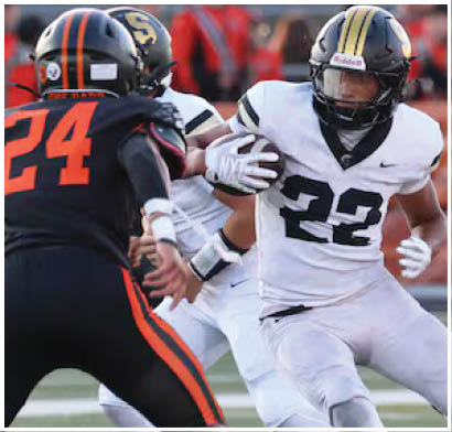 A football player running on the field. Description generated by AI