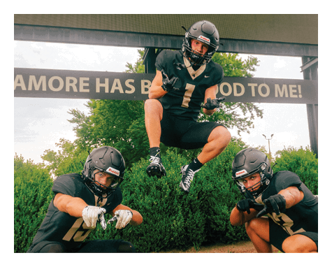 A man in a black jersey is running on a field with a football in his hand. AI generated content