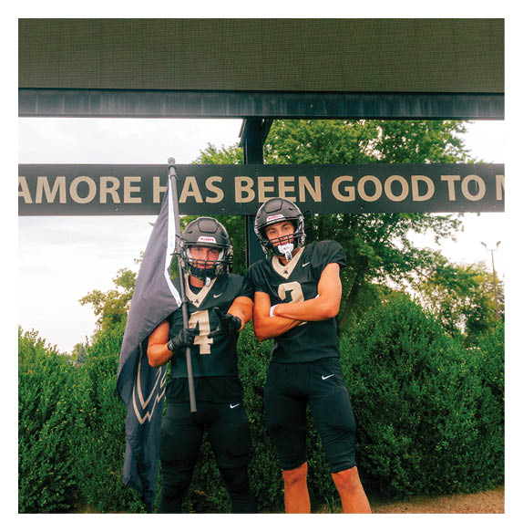 Two football players wearing Vista jerseys and holding hands. AI generated content