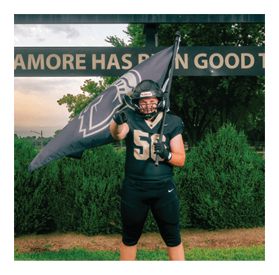 A football player in a white jersey with the number 85 on it is trying to catch a football. AI generated content
