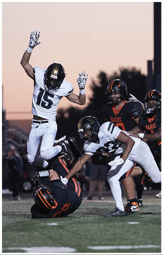 A football player running on the field. Description generated by AI