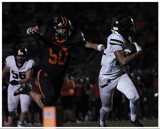 A football player running on the field. Description generated by AI