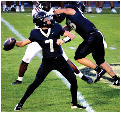 A football player wearing a blue jersey with the number 58 on it. Description generated by AI