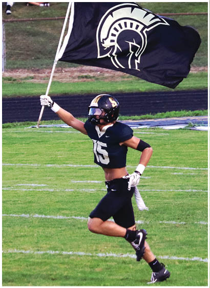 A football player wearing a blue jersey with the number 58 on it. Description generated by AI
